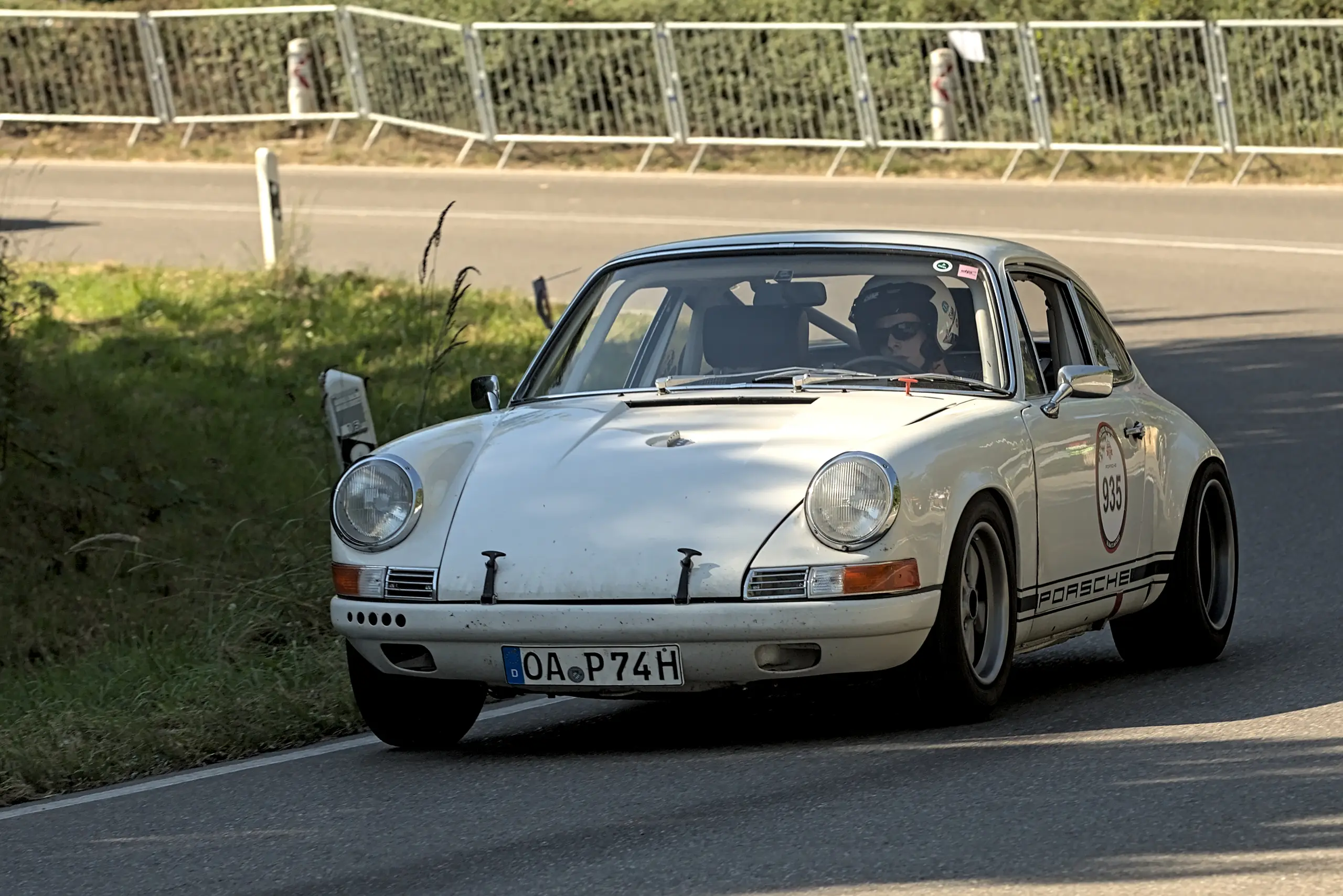 Classic Porsche 911 driving on a winding road